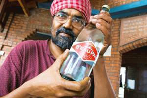Toxic contents: Sarangi of Sambhavna Trust with a bottle of B’eau Pal. Madhu Kapparath / Mint