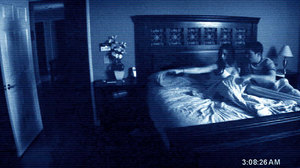 W: Katie and Micha seen on grainy video in 'Paranormal Activity'