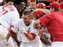 Image: Los Angeles Angels batter Jeff Mathis mobbed by teammates after hitting the game-winning double against the New York Yankees in Anaheim