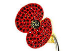 Buckley Jewellery's 18-karat gold poppy is adorned with ruby crystals.