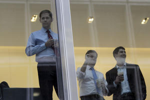 J.P. Morgan Chase employees watch as protestors associated with the Occupy Wall Street movement rally before delivering letters to the corporate headquarters intended for CEO Jamie Dimon, Friday, Oct. 28, 2011, in New York.  