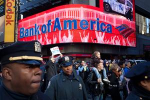 Police follow along to monitor a march of Occupy Wall Street protestors in New York's Times Square, Friday, Oct. 28, 2011. Nearly 400 Occupy Wall Street protesters carried what they said were 7,000 letters of complaint to offices of banks they accuse of corporate greed. 