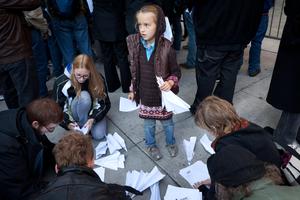Occupy Wall Street protestors make paper airplanes out of letters denouncing bank bailouts and issues related to the financial crisis, to throw towards the front of a Bank of America building, Friday, Oct. 28, 2011, in New York. Nearly 400 Occupy&nbsp;Wall&nbsp;Street protesters carried what they said were 7,000 letters of complaint to offices of banks they accuse of corporate greed. 